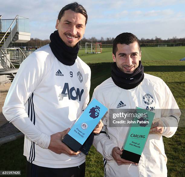 Zlatan Ibrahimovic and Henrikh Mkhitaryan of Manchester United pose with their Carling Player of the Month and Carling Goal of the Month for December...