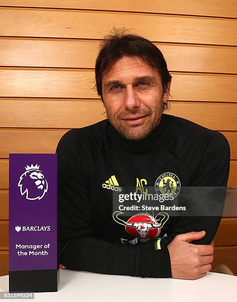 The Chelsea Manager Antonio Conte poses with the Premier League Manager of the Month Award for December 2016 at Chelsea Training Ground on January...