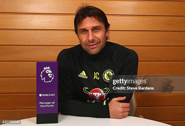 The Chelsea Manager Antonio Conte poses with the Premier League Manager of the Month Award for December 2016 at Chelsea Training Ground on January...