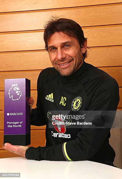The Chelsea Manager Antonio Conte poses with the Premier League Manager of the Month Award for December 2016 at Chelsea Training Ground on January...