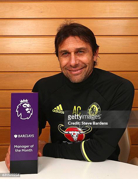The Chelsea Manager Antonio Conte poses with the Premier League Manager of the Month Award for December 2016 at Chelsea Training Ground on January...