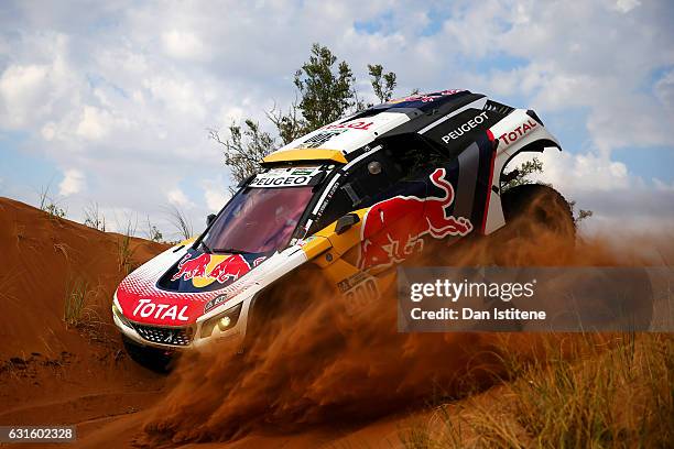 Stephane Peterhansel of France and Peugeot Total drives with co-driver Jean Paul Cottret of France in the 3008 DKR Peugeot car in the Classe : T1.4 2...