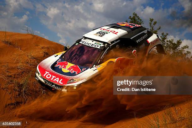 Sebastien Loeb of France and Peugeot Total drives with co-driver Daniel Elena of Monaco in the 3008 DKR Peugeot car in the Classe : T1.4 2 Roues...