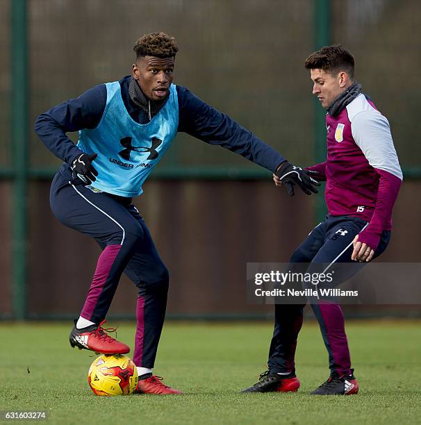 Aaron Tshibola of Aston Villa during a training session with team mate Ashley Westwood at the club's training ground at Bodymoor Heath on January 13,...