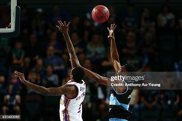 Paul Carter of the Breakers puts up a shot over Greg Whittington of the Kings during the round 15 NBL match between the New Zealand Breakers and the...