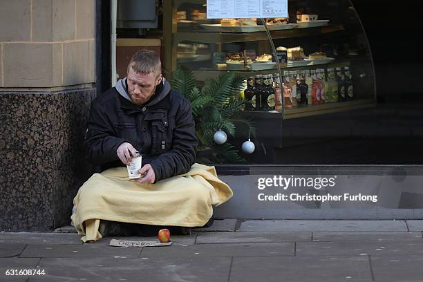 Homeless army veteran Phil begs for small change on the streets of Manchester on January 13, 2017 in Manchester, United Kingdom. Many homeless people...