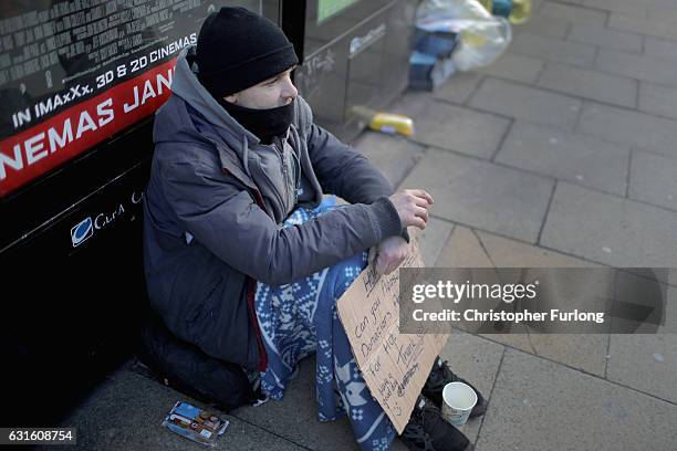 Homeless man begs for small change on the streets of Manchester on January 13, 2017 in Manchester, United Kingdom. Many homeless people are spending...