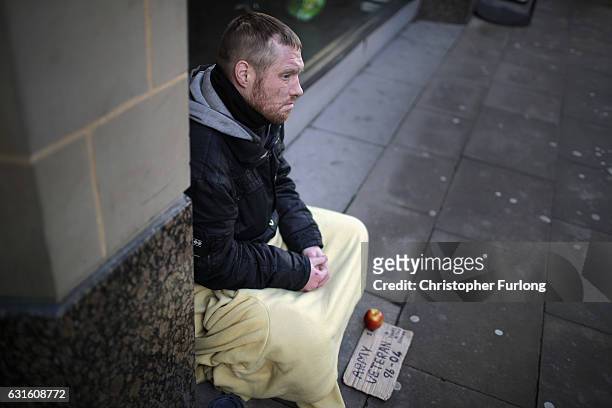 Homeless army veteran Phil begs for small change on the streets of Manchester on January 13, 2017 in Manchester, United Kingdom. Many homeless people...