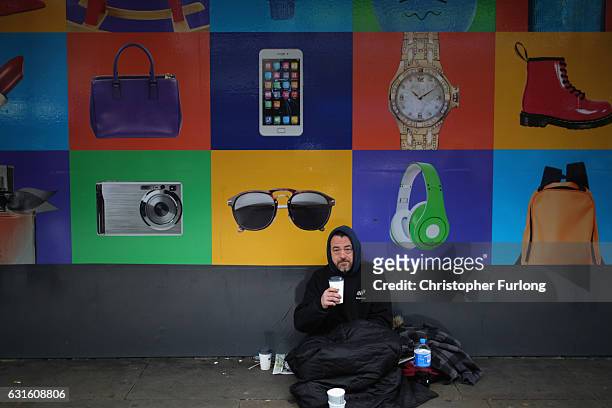 Homeless man begs for small change on the streets of Manchester on January 13, 2017 in Manchester, United Kingdom. Many homeless people are spending...