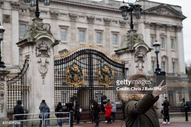 Tourist takes a selfie in front of Buckingham Palace on January 13, 2017 in London, England. Since the EU referendum when Britain voted to leave the...