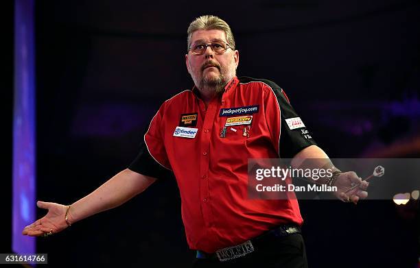 Martin Adams of England reacts during his Mens Quarter Final match against Jamie Hughes of England on day seven of the BDO Lakeside World...