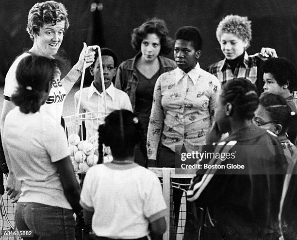 Professional tennis player Betty Stove instruct children at a tennis clinic at the Franklin Field Tennis facility in Dorchester on March 24, 1976.