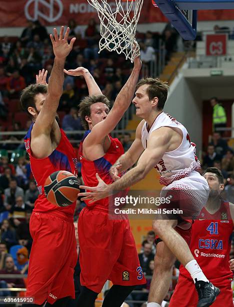 Zoran Dragic, #12 of EA7 Emporio Armani Milan competes with Dmitry Kulagin, #3 and Joel Freeland, #19 of CSKA Moscow in action during the 2016/2017...