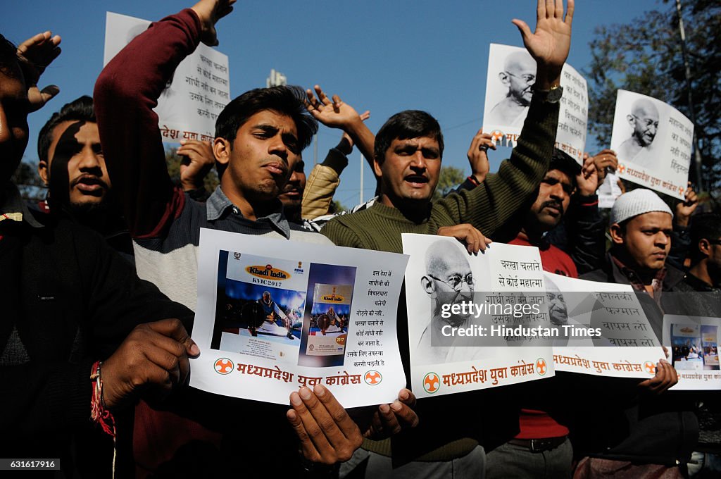 Congress Workers Protest Against Prime Minister Narendra Modi Replacing Mahatma Gandhi In Khadi India Calendar