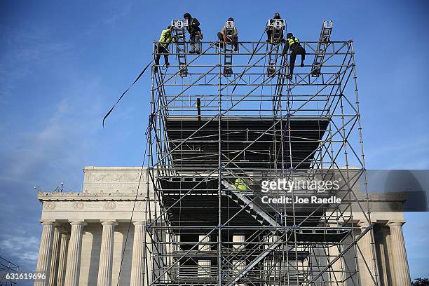 Workers prepare the stage in front of the Lincoln Memorial to be used in the presidential inauguration festivities for President elect Donald Trump...