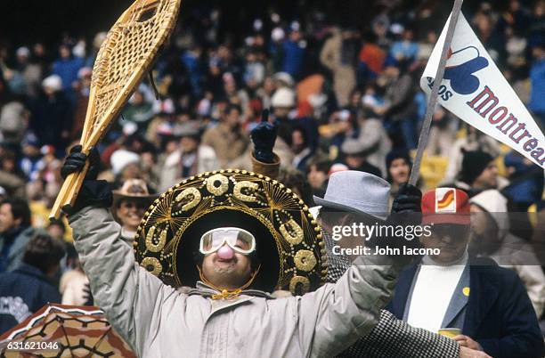 Playoffs: Montreal Expos fan in stands holding rackets and pennant during game vs Los Angeles Dodgers at Olympic Stadium. Game 3. Goofy. Montreal,...