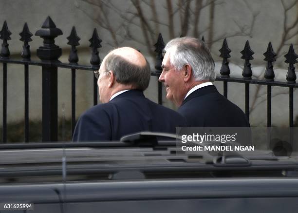 Incoming White House deputy chief of staff Joe Hagin and US President elect Donald Trump's nominee for secretary of state Rex Tillerson walk from the...