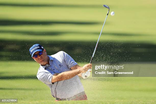 Stewart Cink of the United States plays a shot from a bunker on the ninth hole during the second round of the Sony Open In Hawaii at Waialae Country...