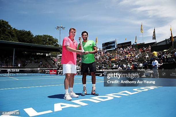 Aisam-UI-Haq Qureshi of Pakistan and Marcin Matkowski of Poland celebrate with the trophy after winning their doubles final match against Jonathan...