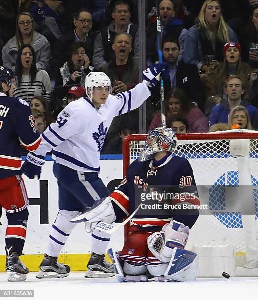 Auston Matthews of the Toronto Maple Leafs celebrates a second period goal by Connor Brown against Henrik Lundqvist of the New York Rangers at...