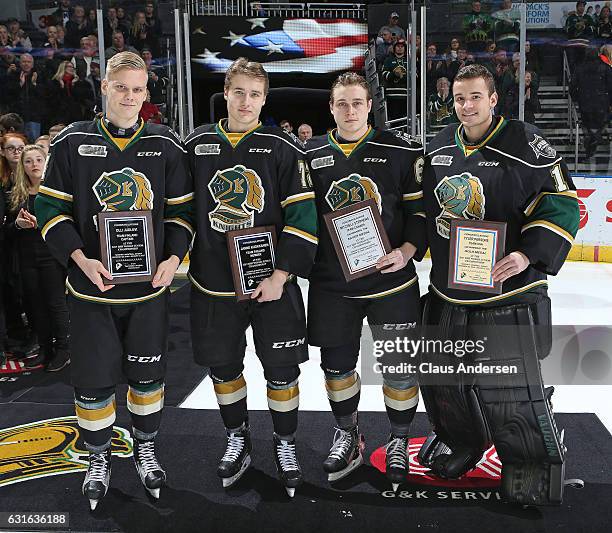 Olli Juolevi, Janne Kuokkanen, Mitchell Stephens, and Tyler Parsons of the London Knights are honoured for their participation in the World Junior...