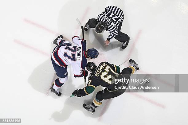 Mitchell Stephens of the London Knights takes a faceoff against Jesse Barwell of the Saginaw Spirit during an OHL game at Budweiser Gardens on...