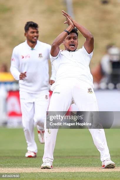 Kamrul Islam Rabbi of Bangladesh celebrates after taking the wicket of Ross Taylor of New Zealand during day three of the First Test match between...