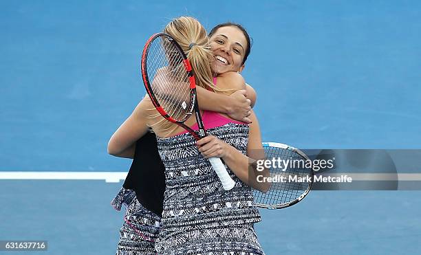 Raluca Olaru of Romania and Olga Savchuk of Ukraine celebrate winning match point in their Women's Doubles Final match against Gabriela Dabrowski of...