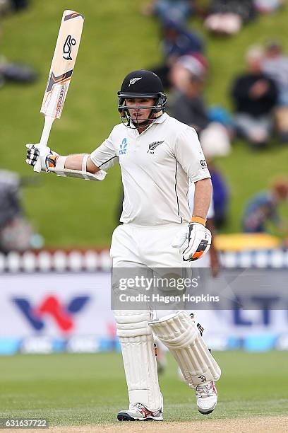 Tom Latham of New Zealand acknowledges his half century during day three of the First Test match between New Zealand and Bangladesh at Basin Reserve...