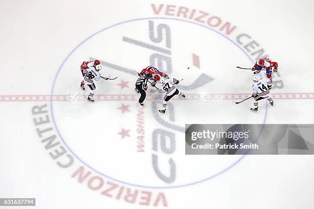 Tanner Kero of the Chicago Blackhawks and Lars Eller of the Washington Capitals face-off at Verizon Center on January 13, 2017 in Washington, DC.