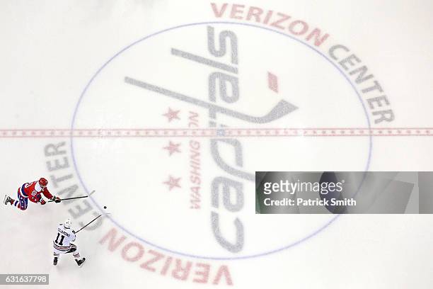Andrew Desjardins of the Chicago Blackhawks and Lars Eller of the Washington Capitals battle for the puck at Verizon Center on January 13, 2017 in...