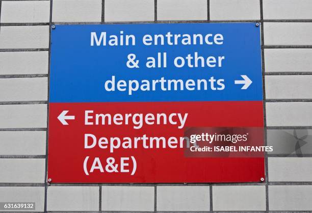 An Accident and Emergency department sign is pictured at St Thomas' Hospital on January 13, 2017 in London. The Red Cross describes a "humanitarian...