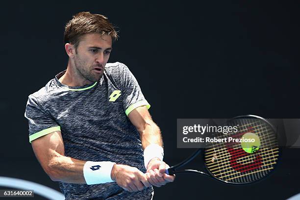Tim Smyczek of USA plays a backhand in his 2017 Australian Open Qualifying match against Frances Tiafoe of USA at Melbourne Park on January 14, 2017...