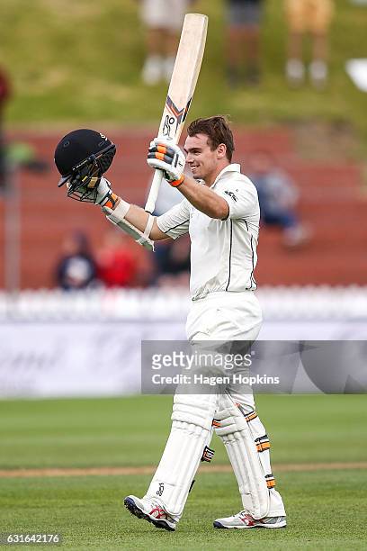 Tom Latham of New Zealand celebrates his century during day three of the First Test match between New Zealand and Bangladesh at Basin Reserve on...