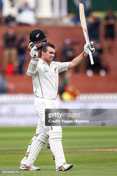 Tom Latham of New Zealand celebrates his century during day three of the First Test match between New Zealand and Bangladesh at Basin Reserve on...