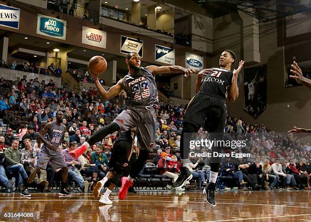 Jabril Trawick from the Sioux Falls Skyforce passes the ball around Anthony Brown from the Erie Bayhawks at the Sanford Pentagon January 13, 2017 in...