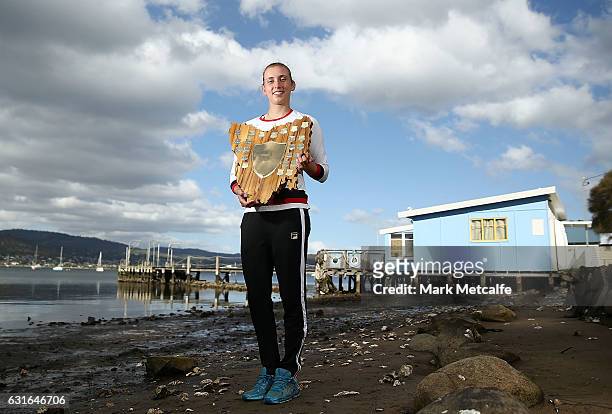 Elise Mertens of Belgium poses with the winners trophy at Cornelian Bay after victory in her singles final match against Monica Niculescu of Romania...