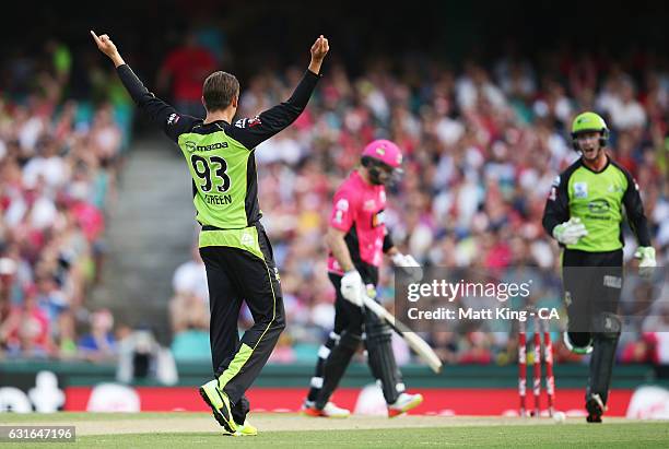 Chris Green of the Thunder celebrates taking the wicket of Michael Lumb of the Sixers during the Big Bash League match between the Sydney Sixers and...