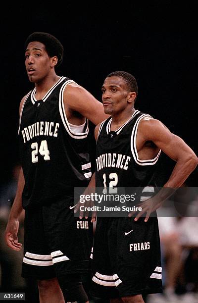 John Linehan and Erron Maxey of the Providence Friars watch the action during the Big Ten Conference game against the Pennsylvania State Nittany...