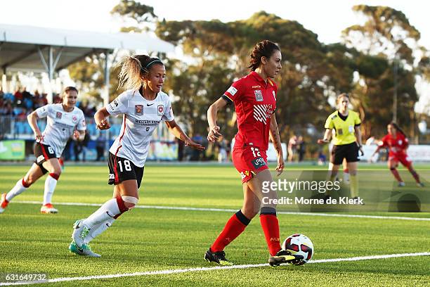 Adriana Jones of Adelaide United wins the ball in front of Angelique Hristodoulou of Western Sydney during the round 12 W-League match between...