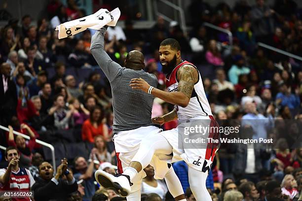 Washington Wizards forward Markieff Morris celebrates late in the game with Washington Wizards guard Marcus Thornton in the second half December 18,...