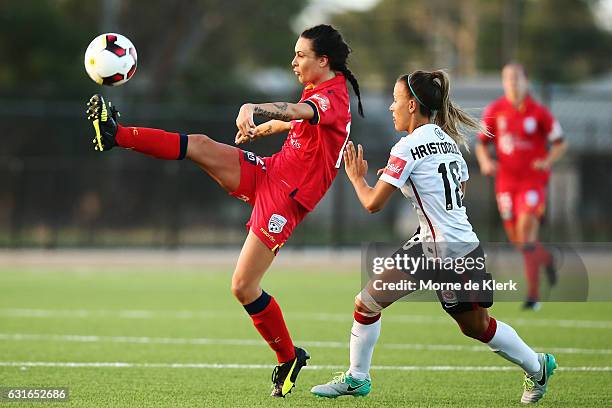 Adriana Jones of Adelaide United wins the ball in front of Angelique Hristodoulou of Western Sydney during the round 12 W-League match between...