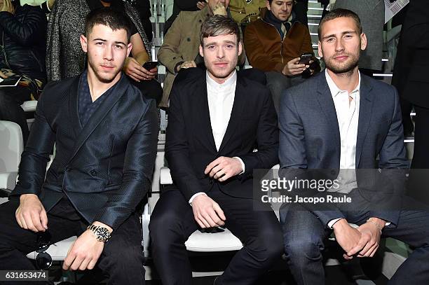 Nick Jonas, Richard Madden and Edward Holcroft attend the Emporio Armani show during Milan Men's Fashion Week Fall/Winter 2017/18 on January 14, 2017...