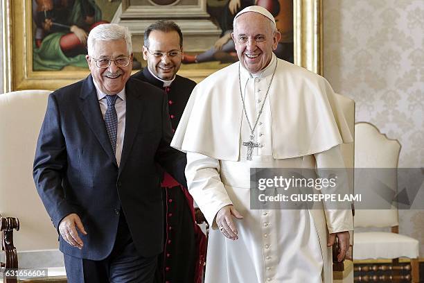 Palestinian president Mahmud Abbas smiles with Pope Francis, during a private audience at the Vatican on January 14, 2017. Abbas meets Pope Francis...