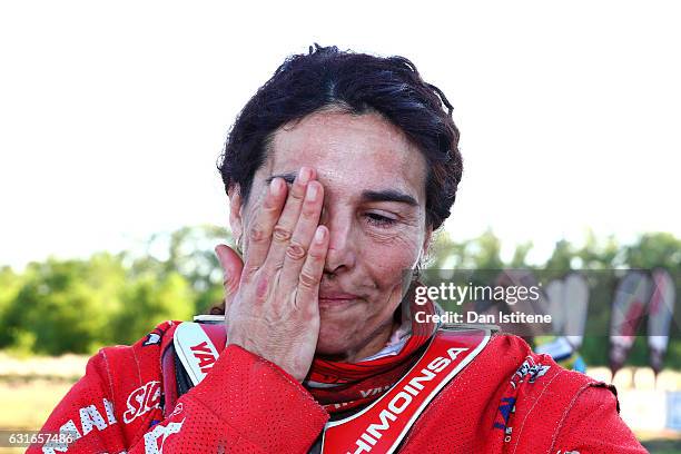 Rosa Romero Font of Spain and KTM Himoinsa wipes away her tears as she celebrates finishing at the finish of stage twelve of the 2017 Dakar Rally on...