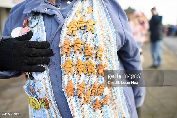 Woman displays her Straw Bear brooches following the annual Whittlesea Straw Bear Festival parade on January 14, 2017 in Whittlesey, United Kingdom....