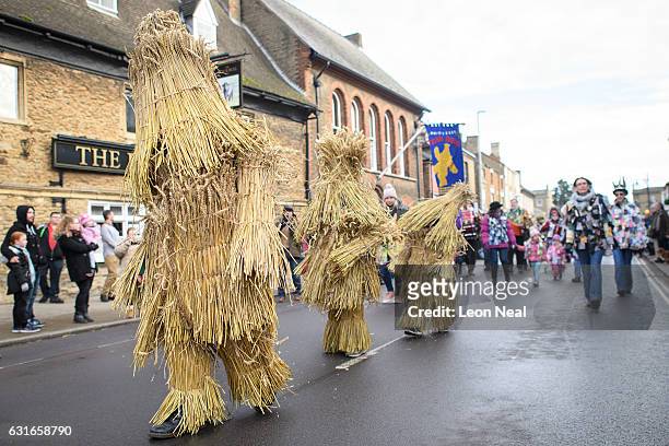 The three Straw Bears are led through the streets during the annual Whittlesea Straw Bear Festival parade on January 14, 2017 in Whittlesey, United...