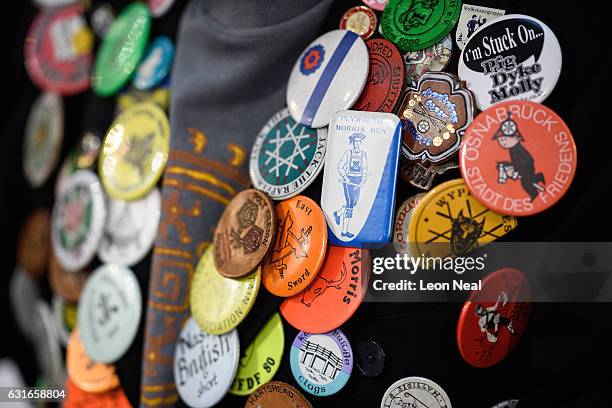 Man displays his English cultural badges before the annual Whittlesea Straw Bear Festival parade on January 14, 2017 in Whittlesey, United Kingdom....
