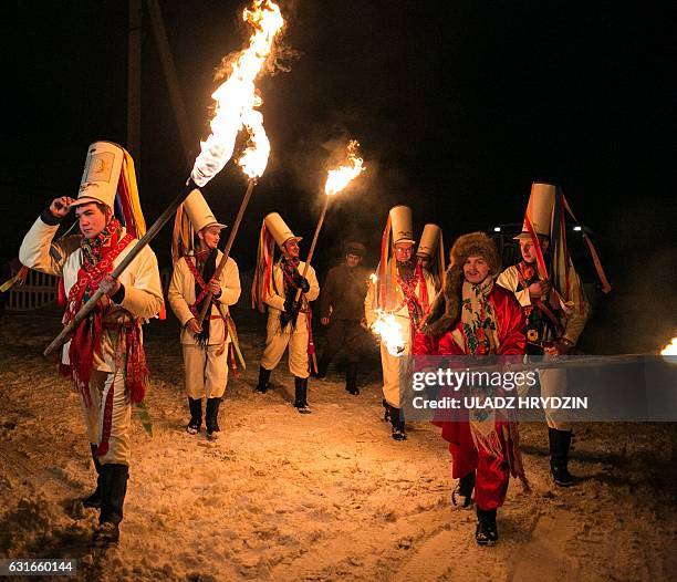 Belarusian people perform during a celebration of "Tsari" rite in the village of Semezhevo, some 160 km south-west of Minsk on January 2017. That...