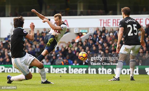 Harry Kane of Tottenham Hotspur scores his sides third goal during the Premier League match between Tottenham Hotspur and West Bromwich Albion at...